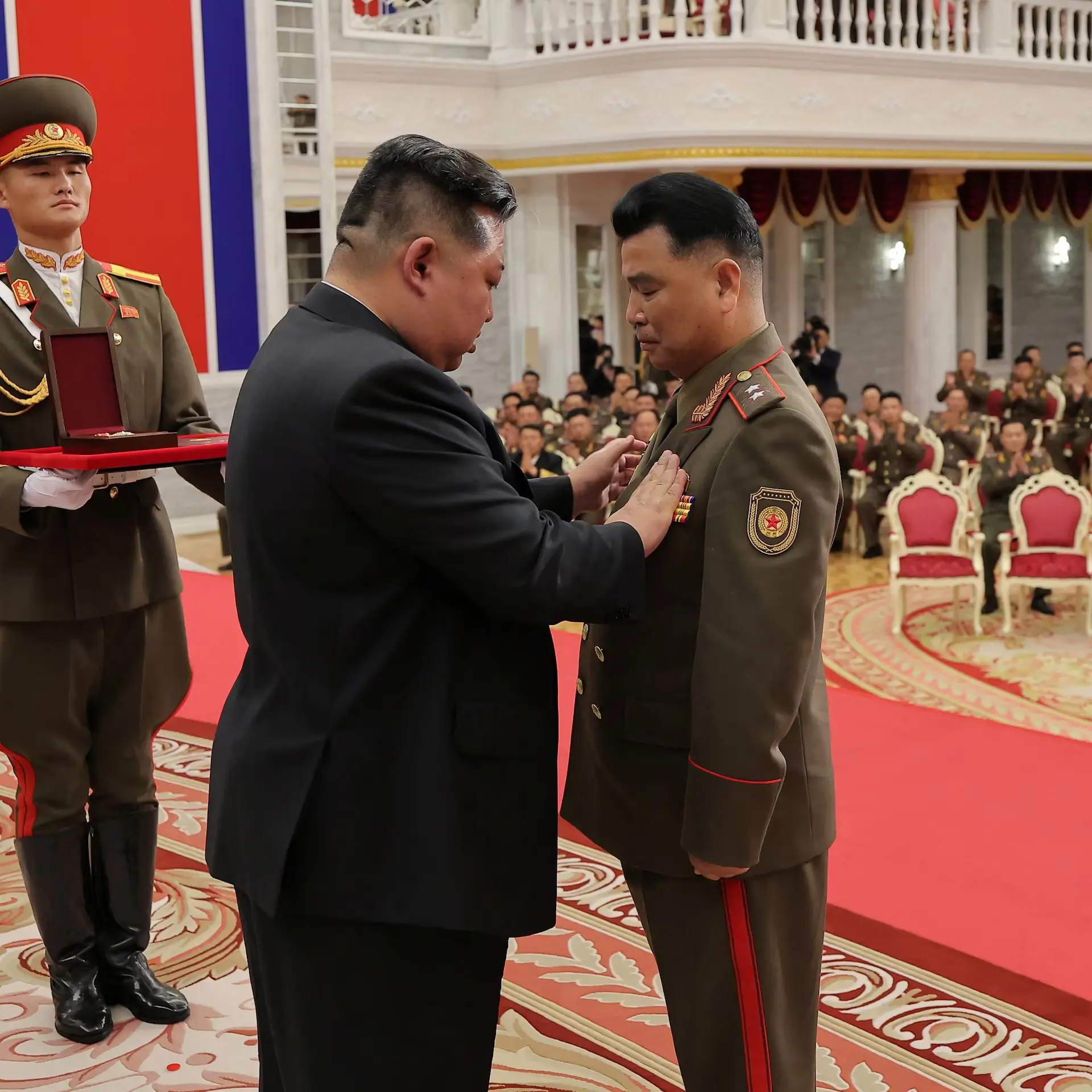 A military ceremony — the part that also exists, and doesn’t fit a simple narration.